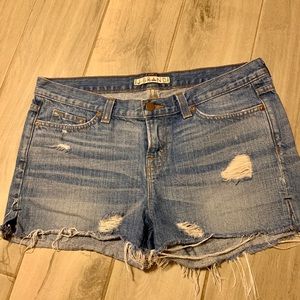J Brand distressed, cut off jean shirts.